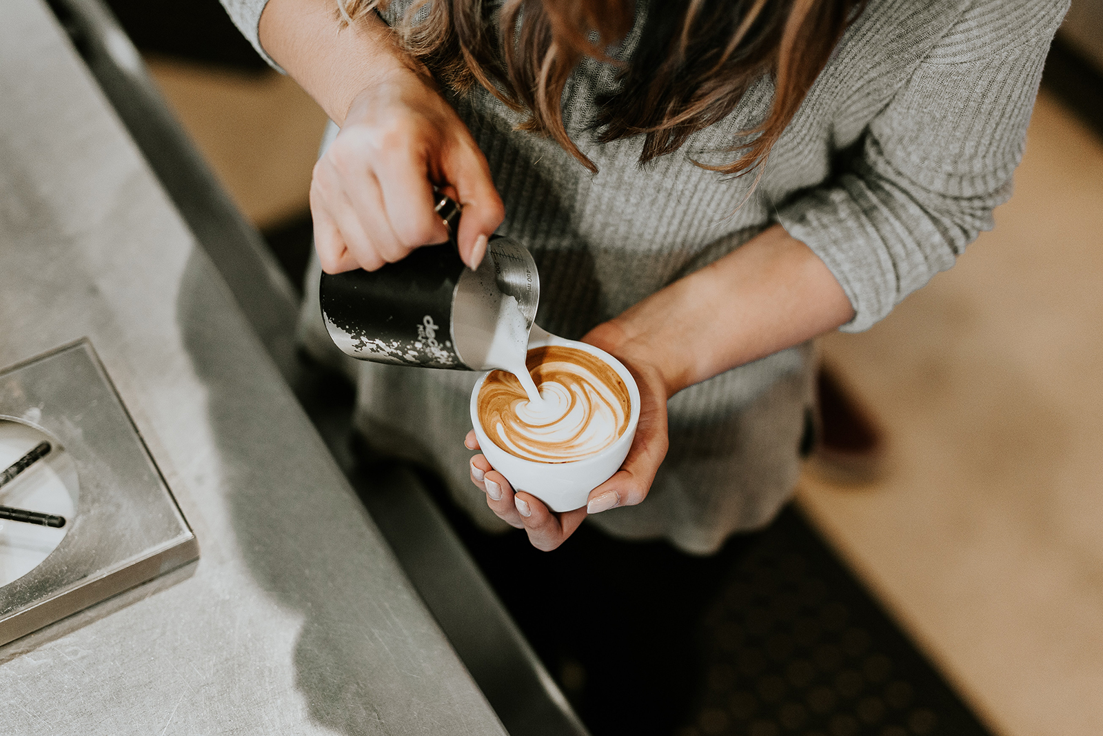 stock image f a barista pouring coffee