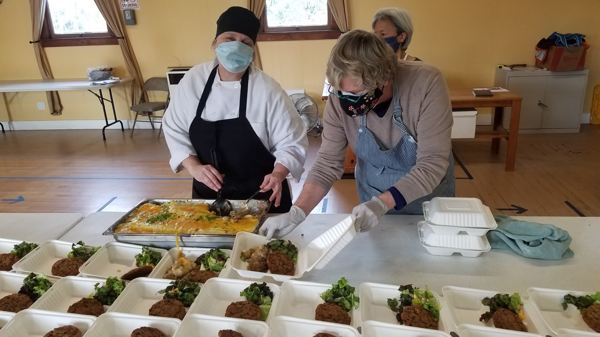 Sonoma Overnight Support serving food at the Springs Hall.
