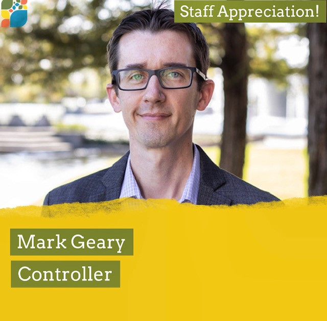 Mark Geary wearing a suit and reading glasses as he stands in front of tall trees. Text: Staff Appreciation!, Mark Geary, Controller