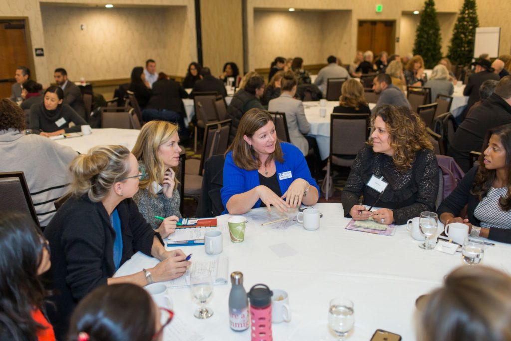 Resilience Convening - people talking around a table