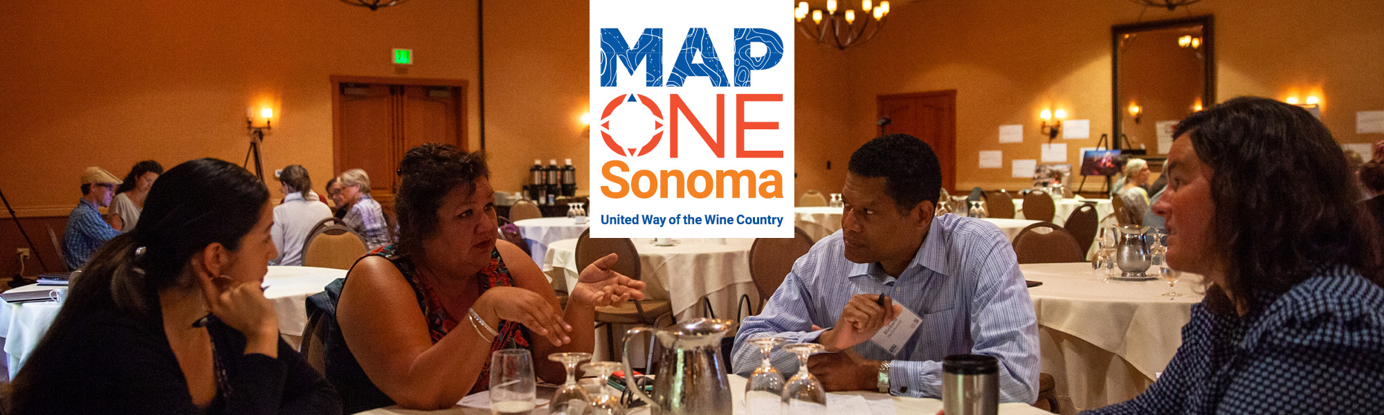 Community members gathered around a table. Text: Map OneSonoma, United Way of the Wine Country