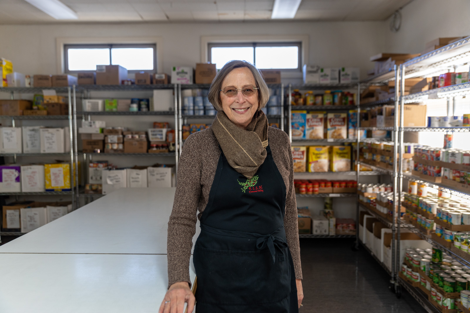 Sandy Piotter, Executive Director for FISH Sonoma stands in the food pantry